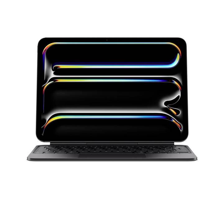 Tablet s černou obrazovkou a abstraktním, barevným designem. Stojí na černé klávesnici, pohled zepředu.