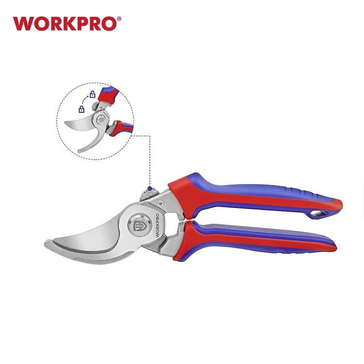 Zahradnické nůžky na větve s červeným a modrým madlem. Zobrazuje detail zajištění čepele. Značka 'WORKPRO' v levém horním rohu.