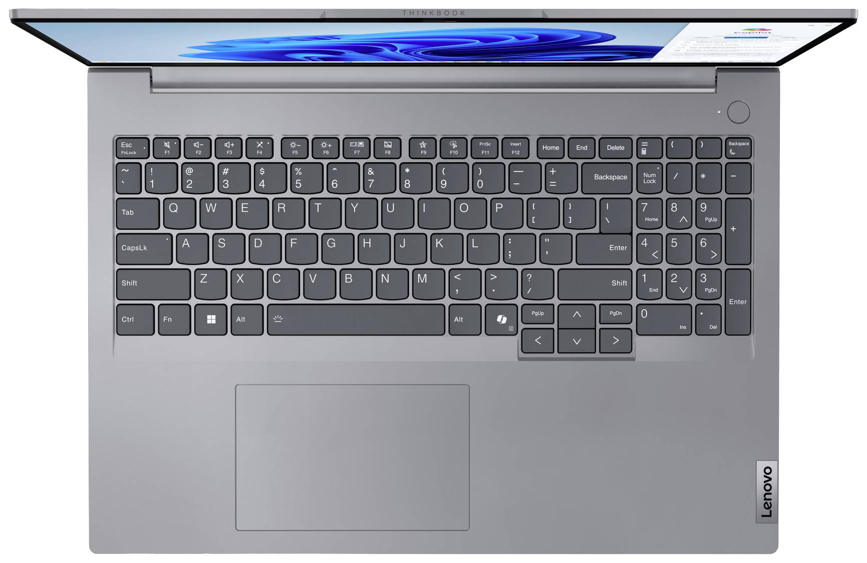 Laptop pohledem shora, zobrazující německé QWERTZ rozložení klávesnice s touchpadem pod ní. Obrazovka je částečně viditelná.