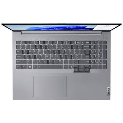 Laptop pohledem shora, zobrazující německé QWERTZ rozložení klávesnice s touchpadem pod ní. Obrazovka je částečně viditelná.