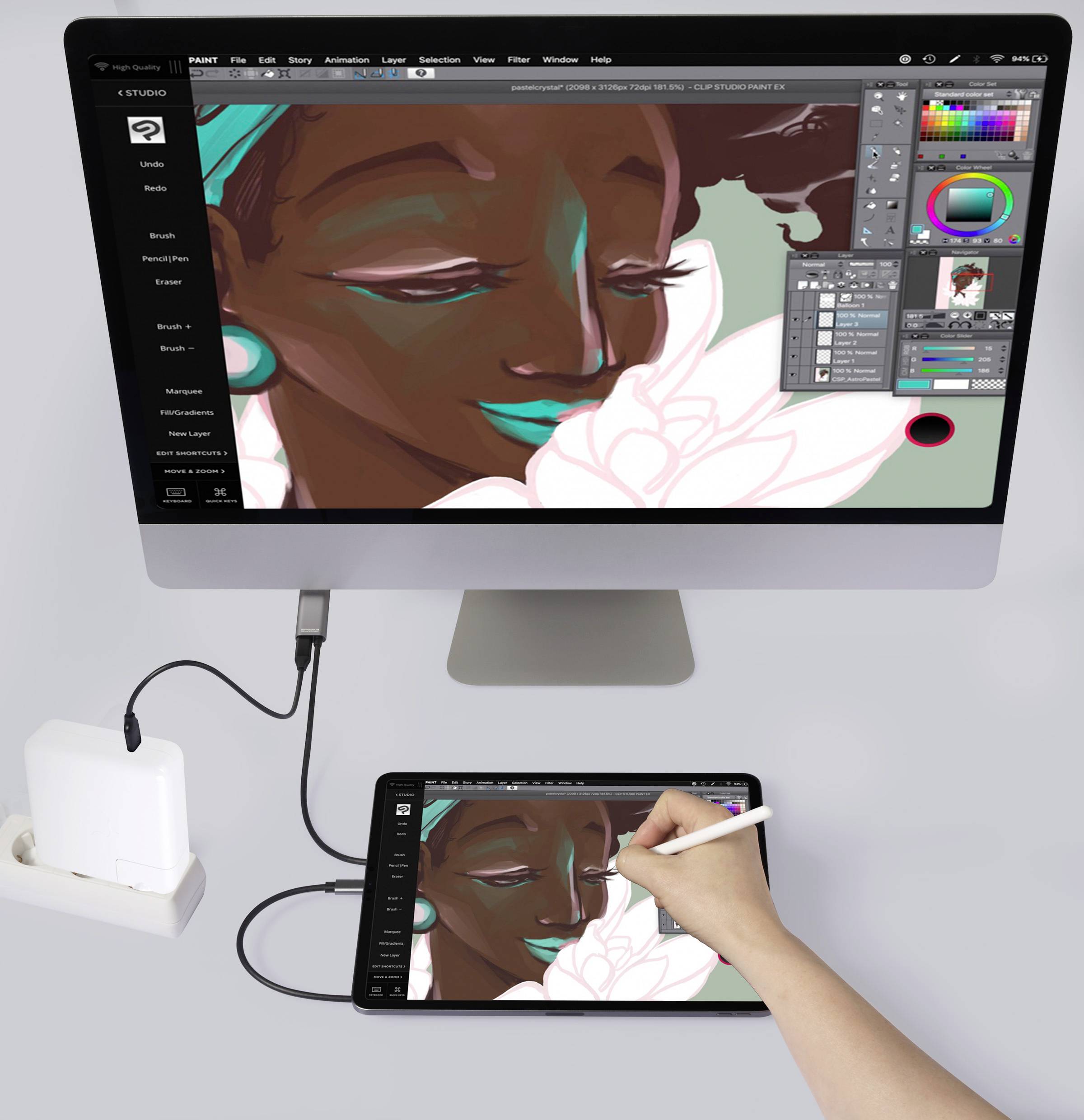 Osoba kreslí digitální ilustraci na tabletu připojeném k počítači. Na obrazovce jsou viditelné barevné palety a nástroje.