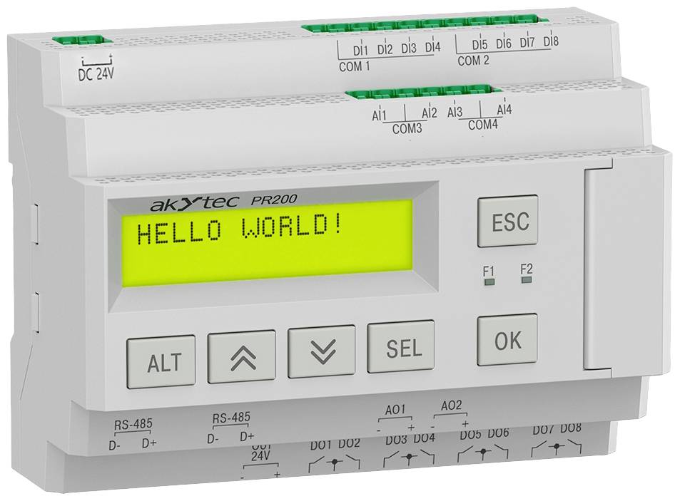 Programovatelný logický kontrolér s displejem zobrazuje 'HELLO WORLD!'. Obsahuje tlačítka a početné možnosti připojení.