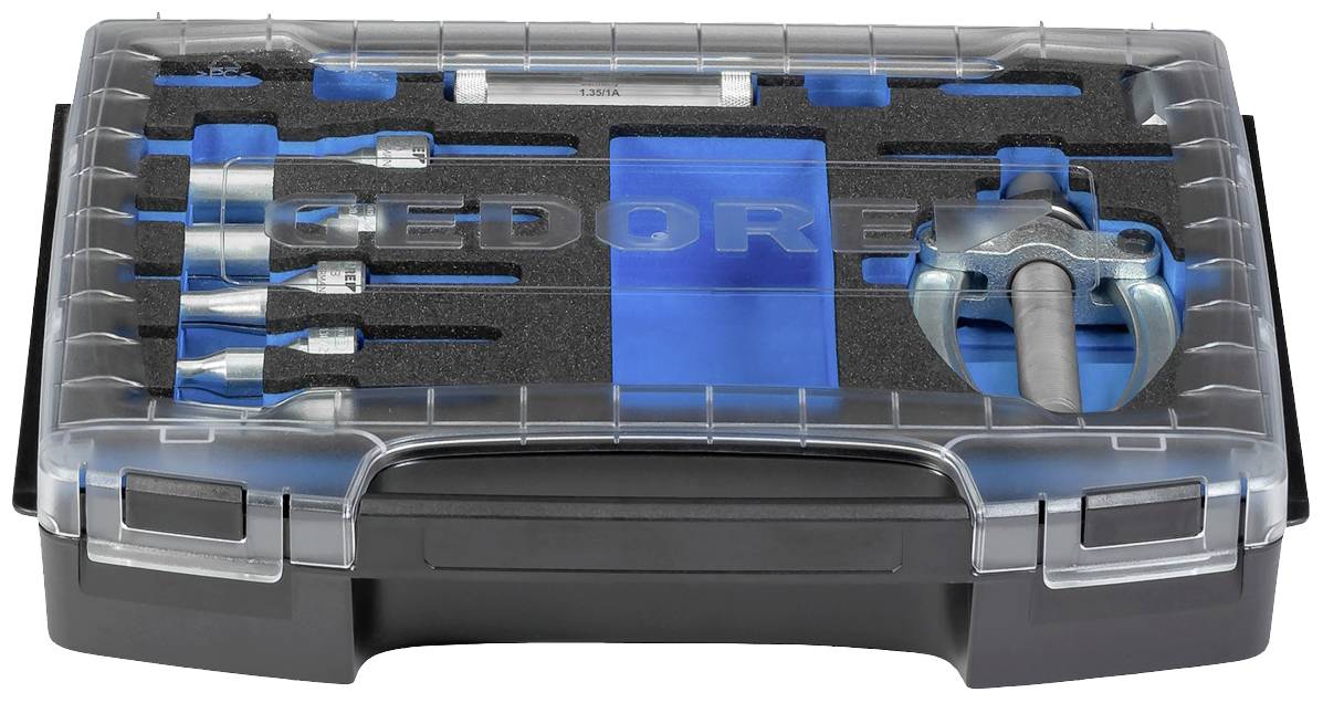 Sada nářadí v kufříku s různými nástroji, včetně šroubováků a kladiva. Na víku je vyražen název značky.