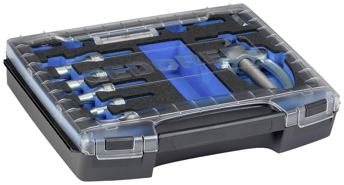 Sada nářadí s několika nástrčnými klíči a příslušenstvím, uspořádaná v modré pěnové vložce s průhledným víkem.