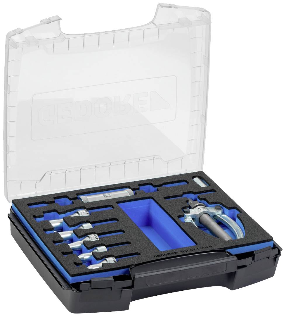 Sada nářadí s otevřeným víkem. Obsahuje klíče v pěnových vložkách. Kufřík s průhledným víkem.
