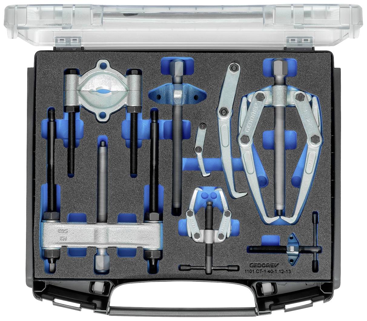 Sada nástrojů v kufříku s různými stahovacími přípravky uloženými v pěnové výstelce, včetně velkého trojramenného stahováku a menších specializovaných stahovacích nástrojů.