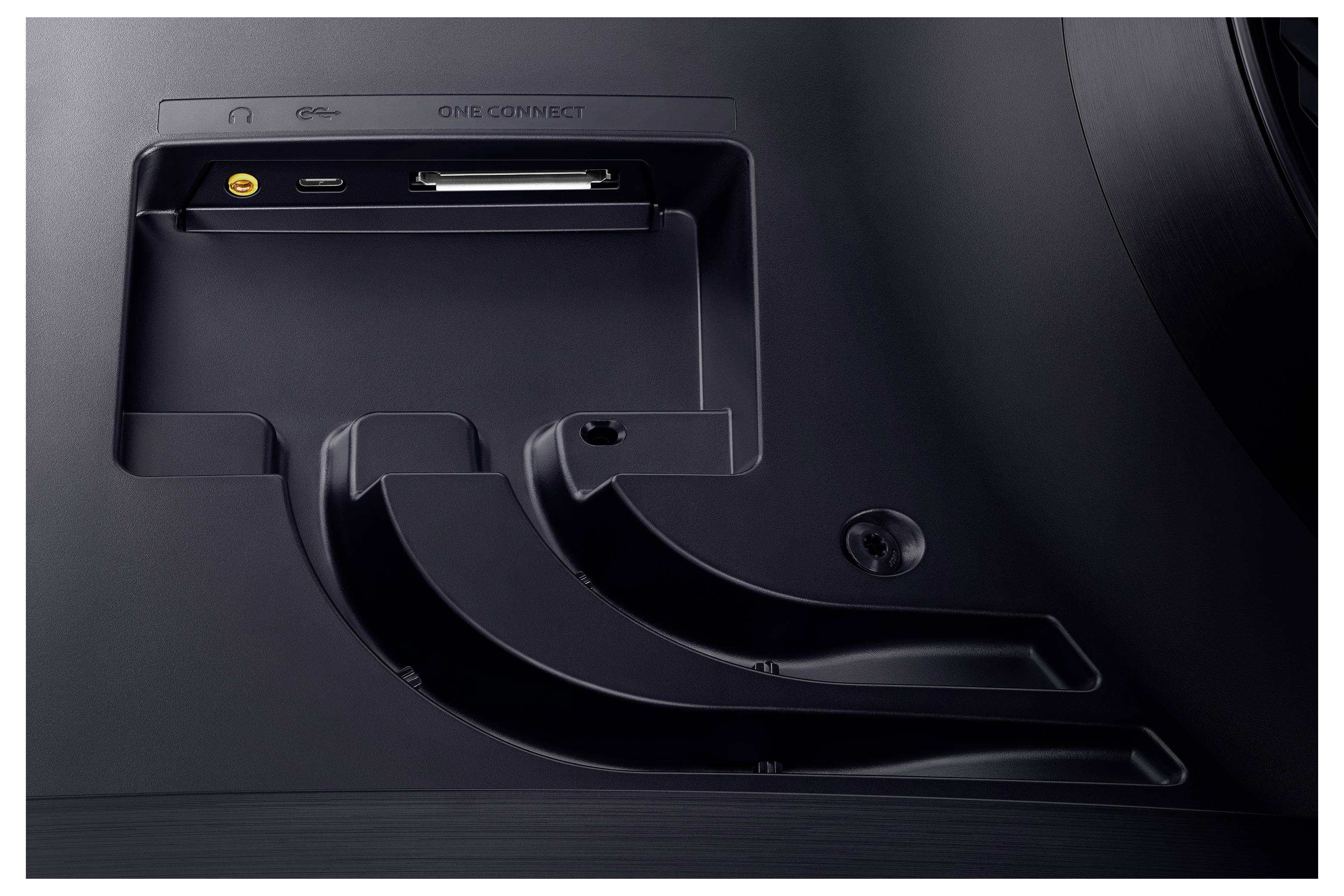 Černý zadní panel TV s připojovacím polem, který zobrazuje konektory pro sluchátka, USB a HDMI. Nápis "One Connect" je viditelný.