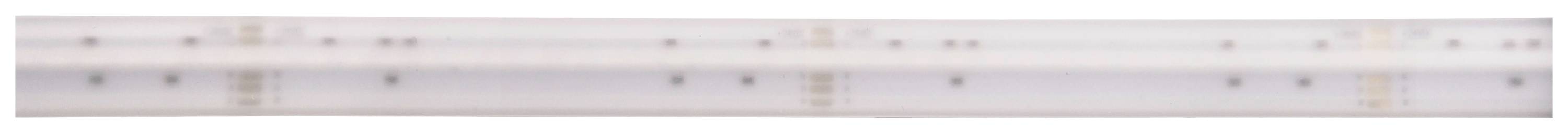 Bílý obdélníkový předmět s několika tmavými čarami a body, pravděpodobně technické zařízení nebo komponenta.