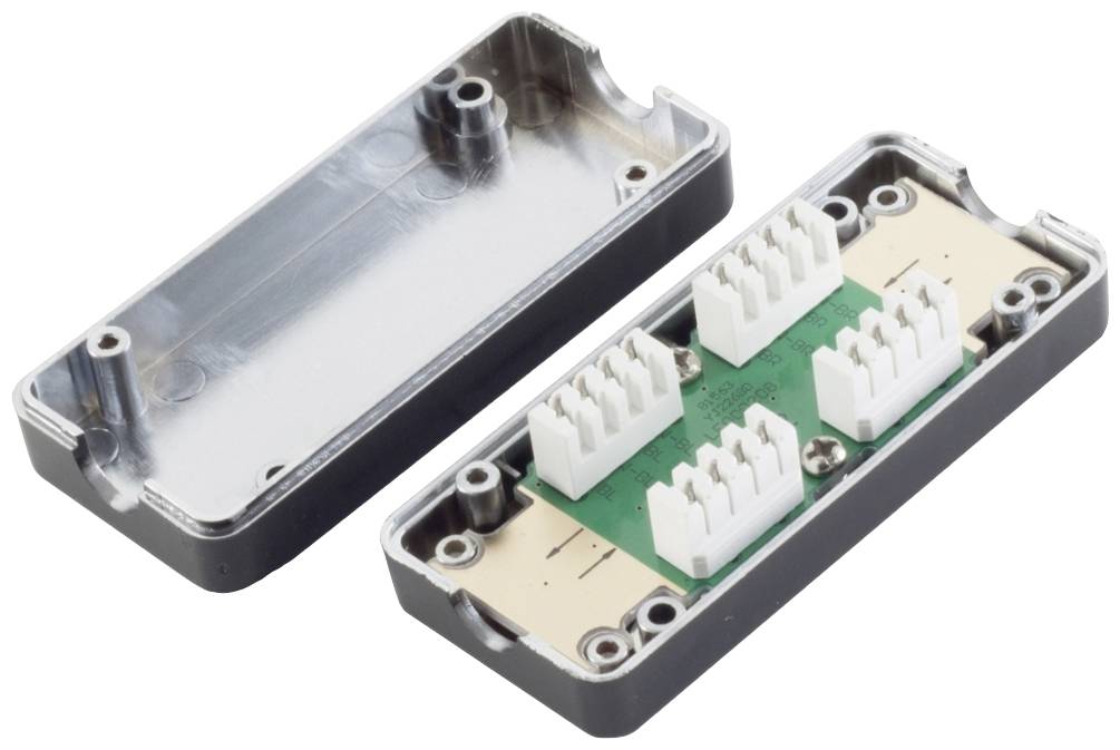 Otevřená, obdélníková elektronická komponenta s zelenou deskou plošných spojů a několika bílými konektory uvnitř.