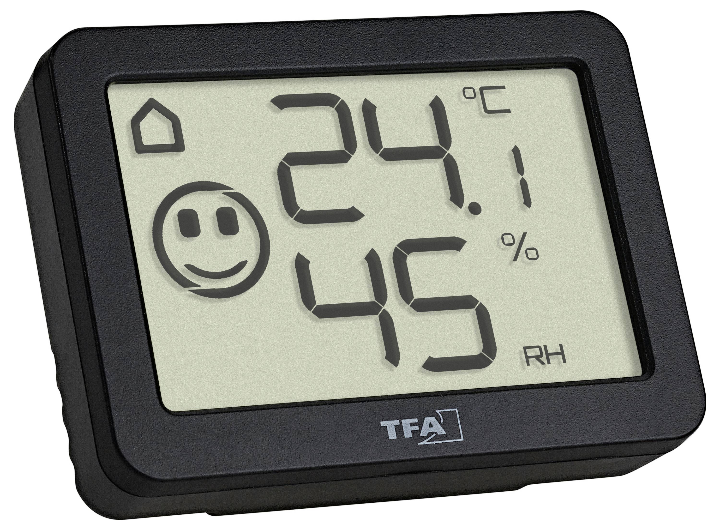 Digitální teploměr a vlhkoměr se smajlíkem, ukazuje 24,1 °C a 45 % relativní vlhkosti.