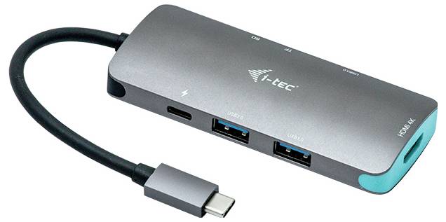 USB-C hub s HDMI portem, dvěma USB porty a ethernetovým adaptérem. Stříbrné tělo s černým kabelem.