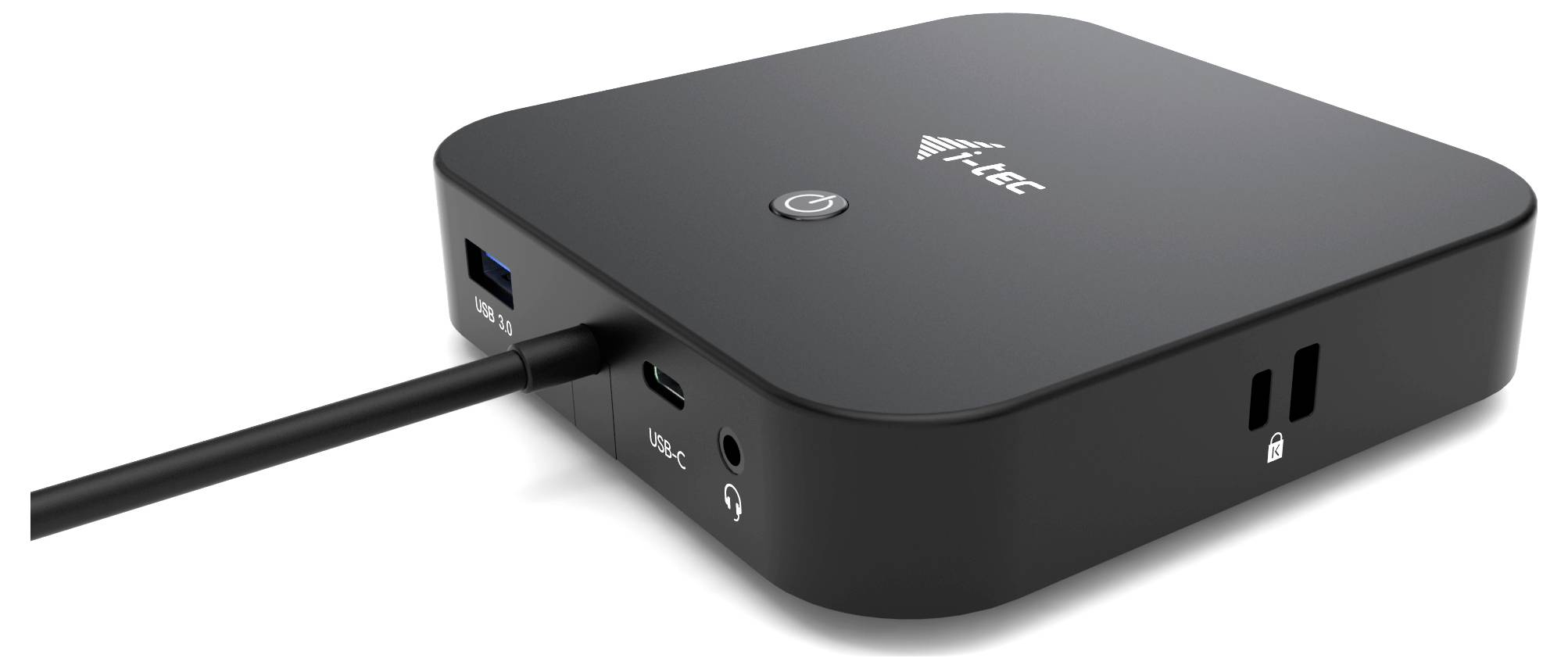 Černá dokovací stanice s několika porty, včetně USB, USB-C, Audio a Ethernet, s logem a tlačítkem na horní straně.