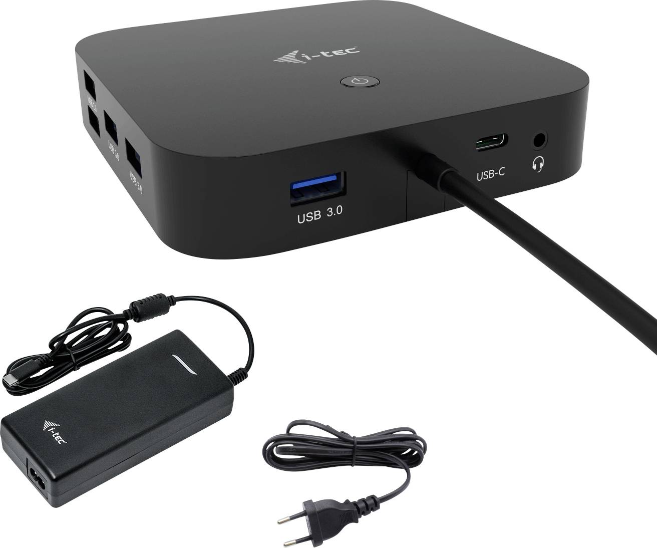 Černý kryt dokovací stanice I-Tec s různými porty: USB 3.0, USB-C. Vedle něj síťový adaptér a napájecí kabel.