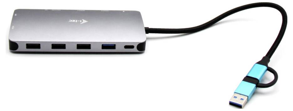 Stříbrný USB hub se čtyřmi porty a modrým USB konektorem, propojený černým kabelem.