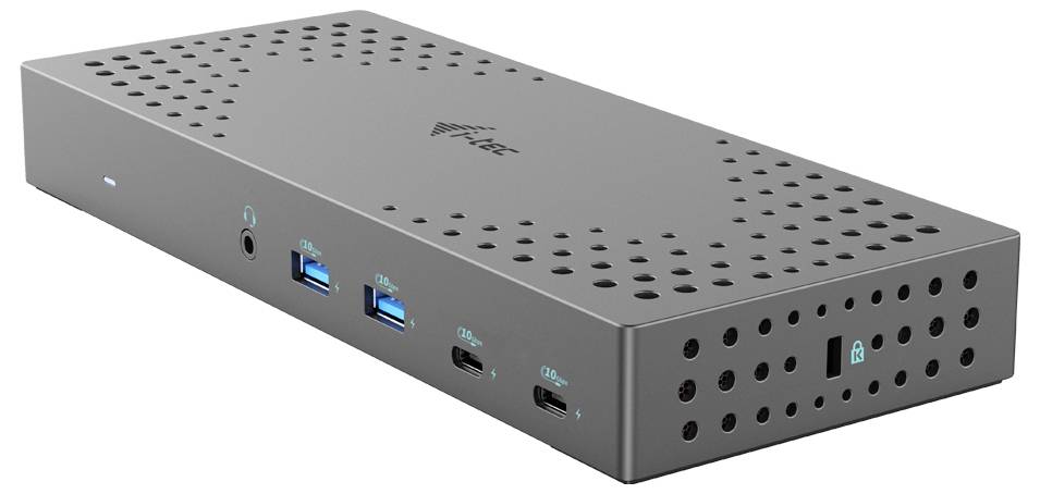 Šedá dokovací stanice s několika porty: dva USB-A, dva USB-C a jeden audio port, vhodná pro počítače.