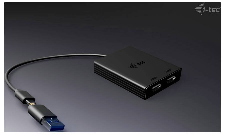 Černý USB adaptér se dvěma HDMI porty a jedním USB konektorem. Na adaptéru je viditelná značka 'i-tec'.