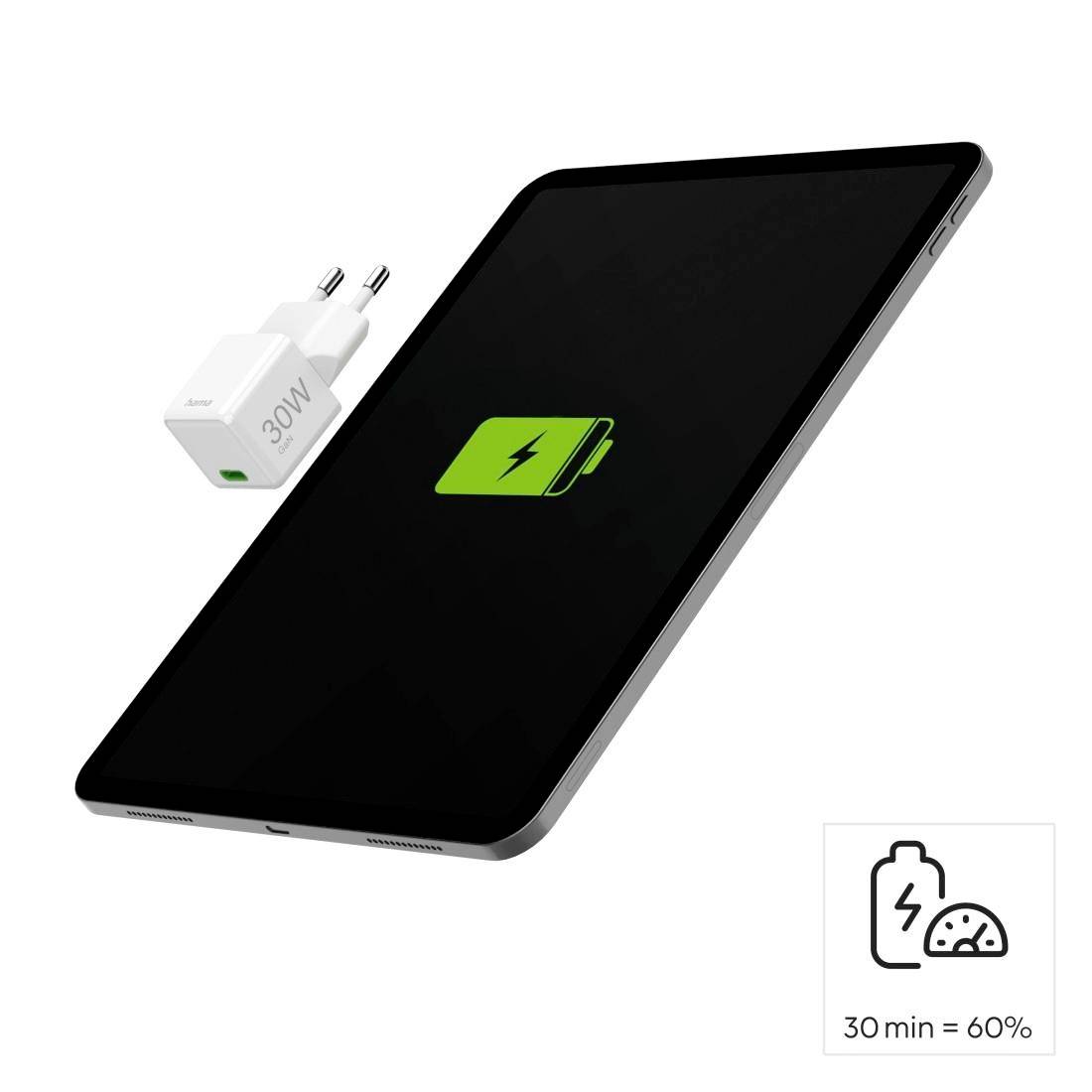 Tablet s nabíjecí ikonou na displeji a nabíječkou vedle něj. Popis uvádí '30 min = 60%'.