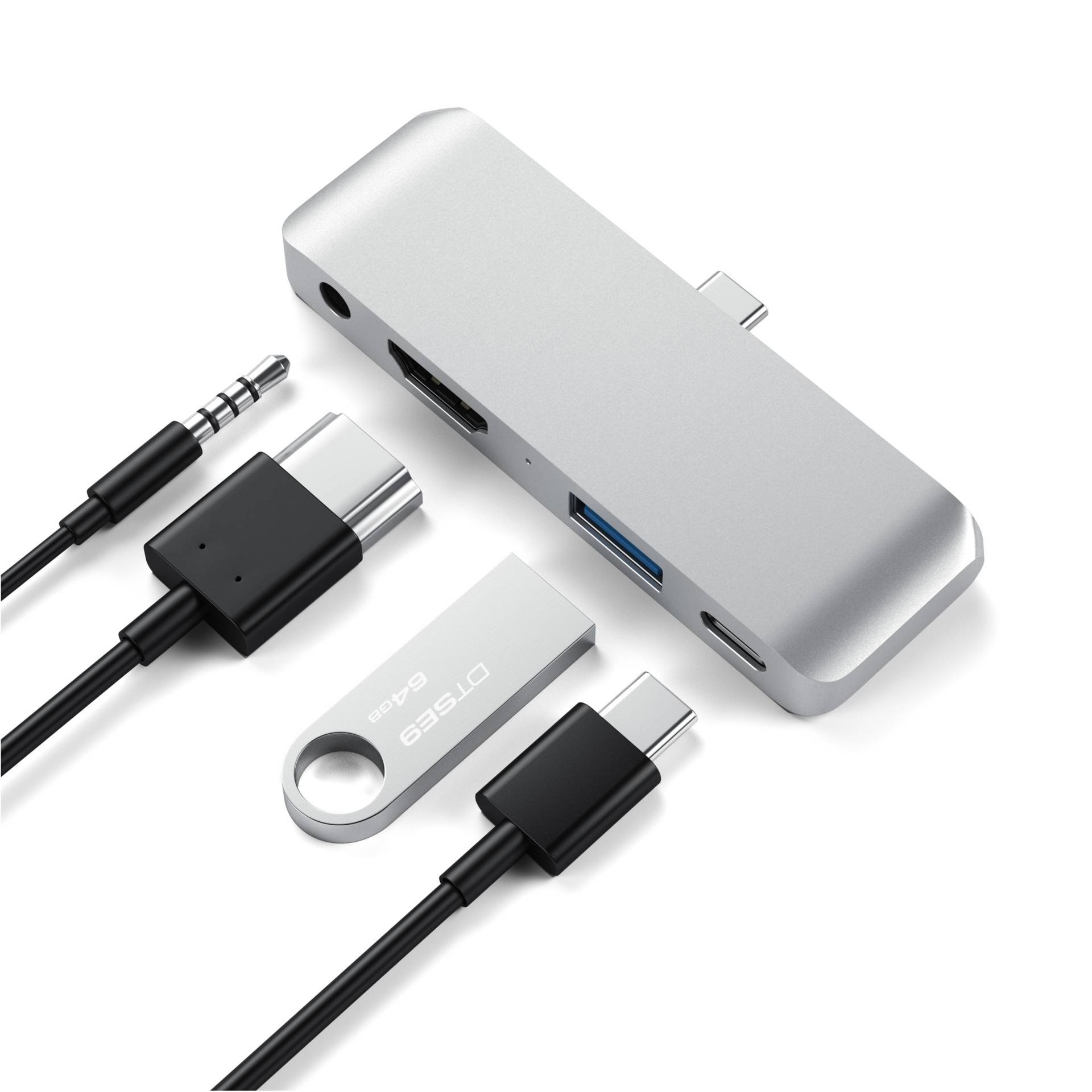 USB-C hub s několika porty: HDMI, USB-A, USB-C a audioport, vhodný pro notebooky a tablety. Obsahuje kabelový adaptér.
