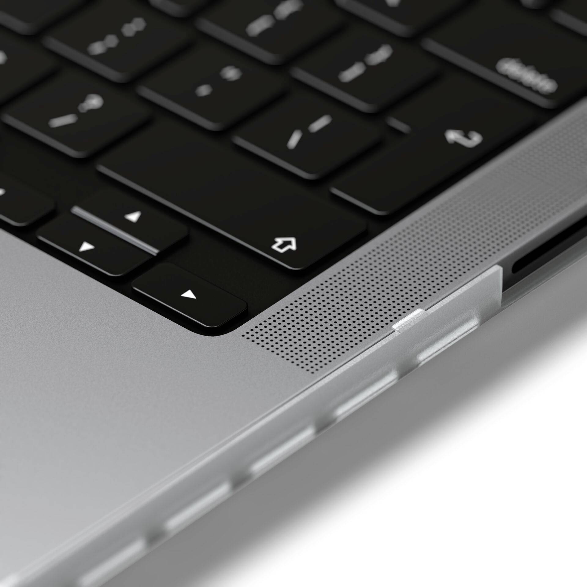 Stříbrný notebook s černou klávesnicí a integrovaným reproduktorem v horním pravém rohu vedle touchpadu.