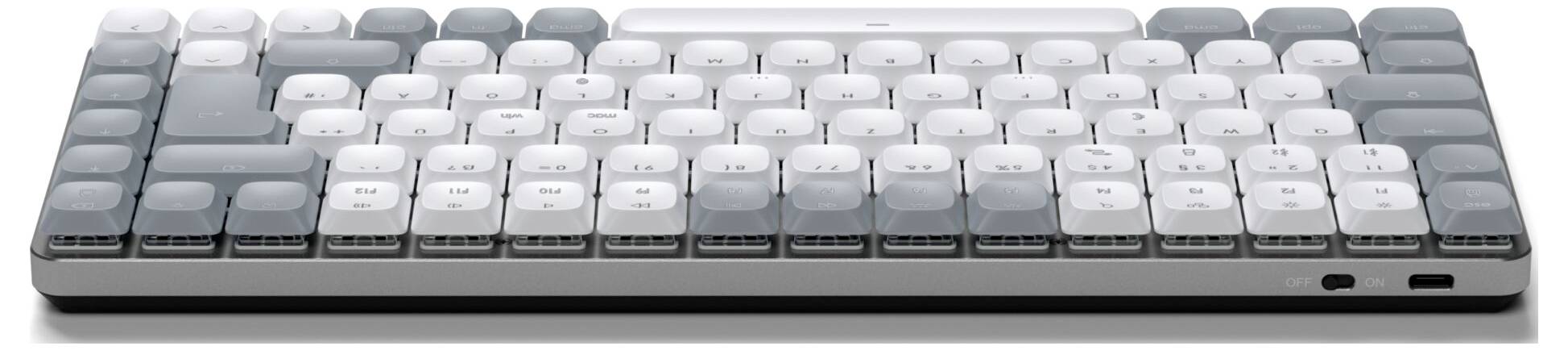 Počítačová klávesnice s šedými a bílými klávesami, kompaktní design, bez numerické části, USB port vpravo.