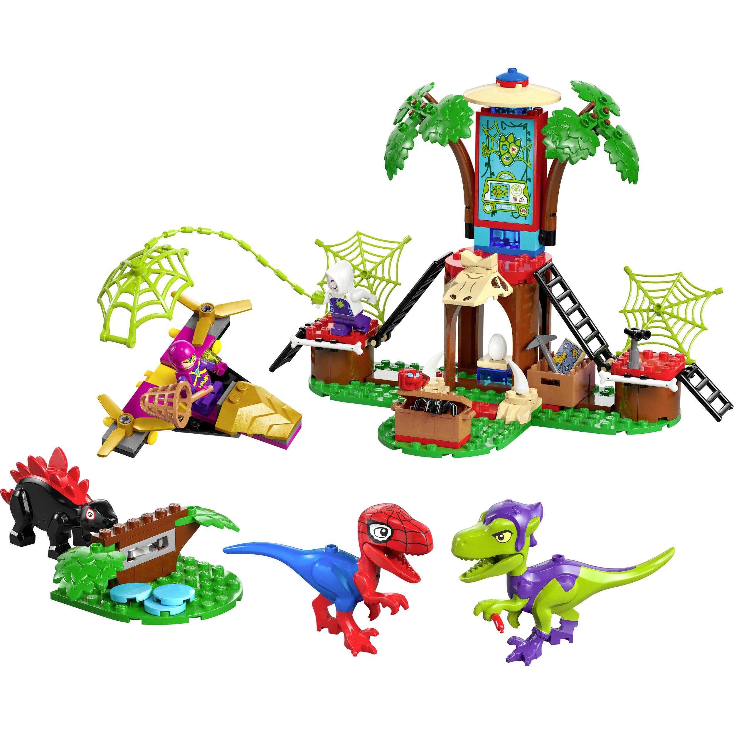 Barevná scéna s hračkami dinosaurů, která obsahuje několik figurek, stromovou pevnost a letadlo. Design přátelský k dětem.