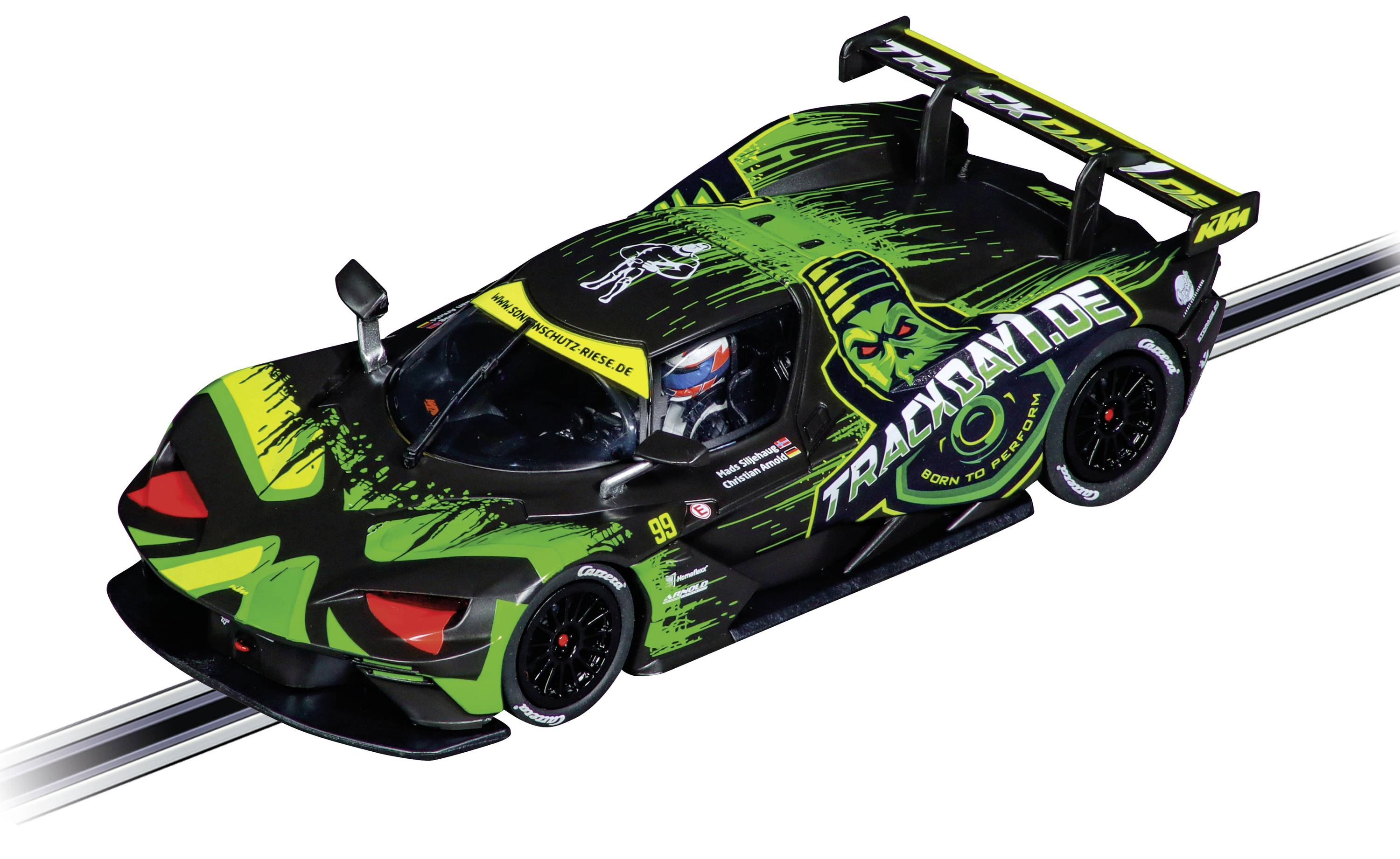 Černé závodní auto s zelenými a žlutými akcenty na závodní dráze. Křídlo na zadní části, sportovní design.