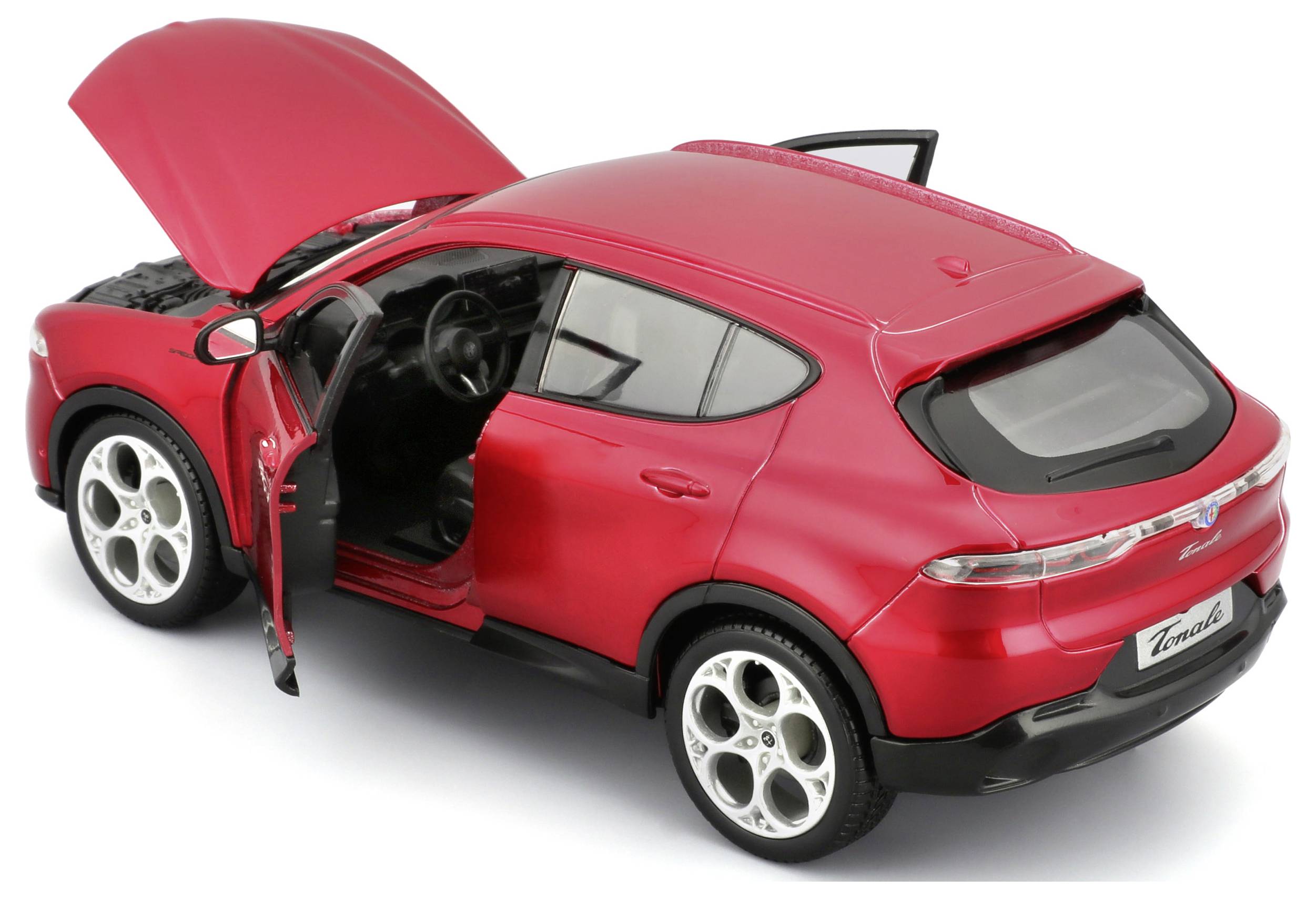 Červené modelové auto s otevřenými dveřmi a kapotou odhaluje detaily interiéru a motoru.