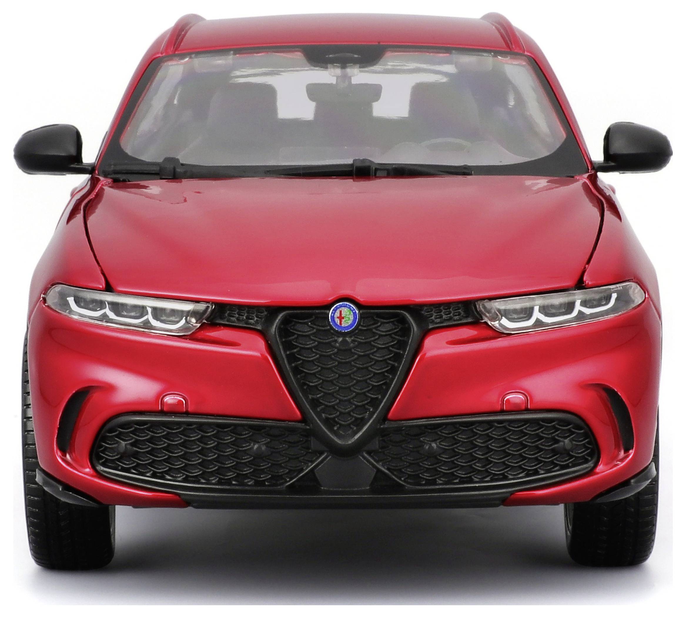 Červený SUV zepředu, výrazný design s LED světlomety a emblematickým logem na přední mřížce chladiče.