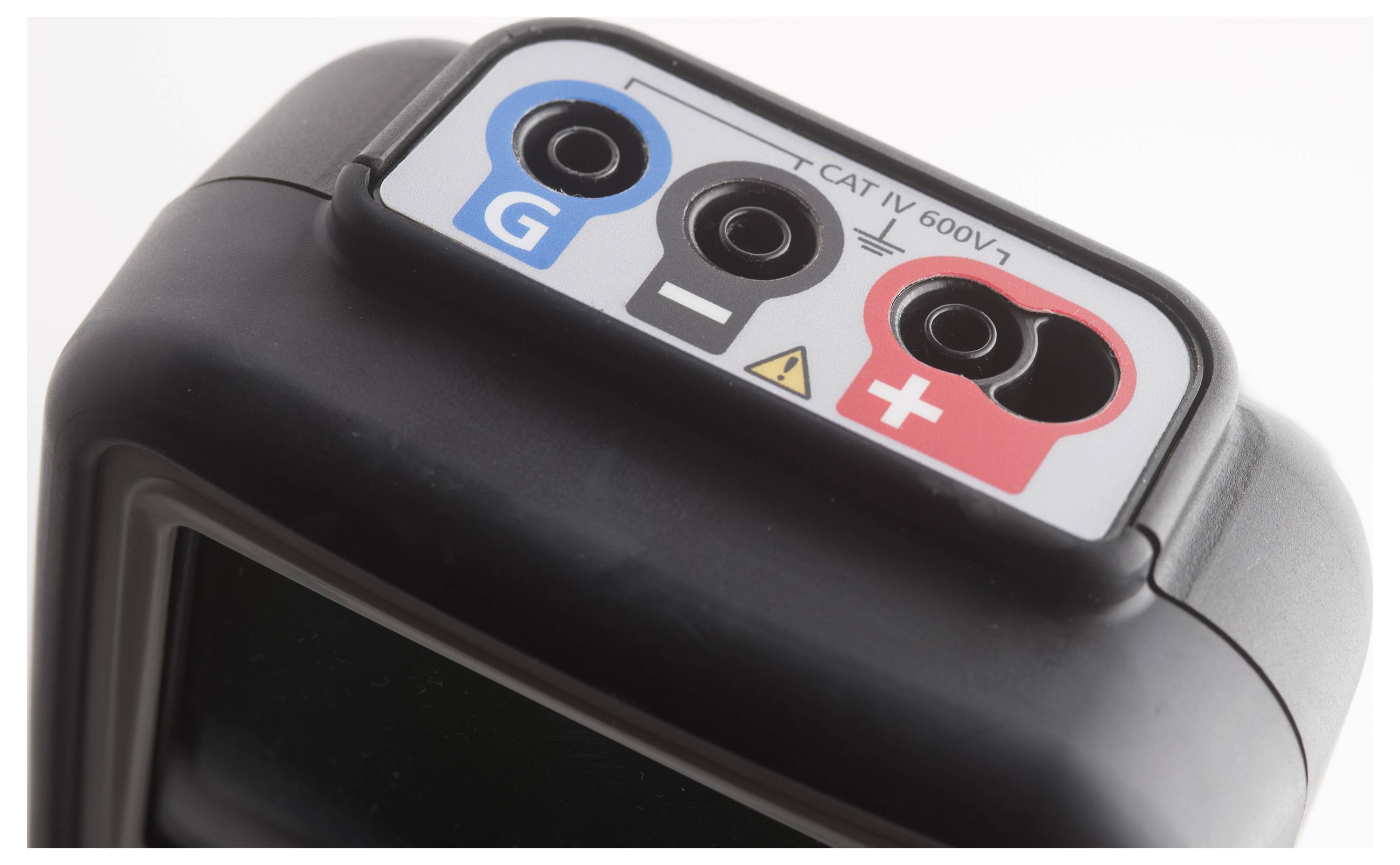 Elektronické zařízení se třemi zdířkami: 'G' (modrá), 'CAT IV 600V' (černá), '+' (červená). Výstražný symbol mezi černou a červenou zdířkou.