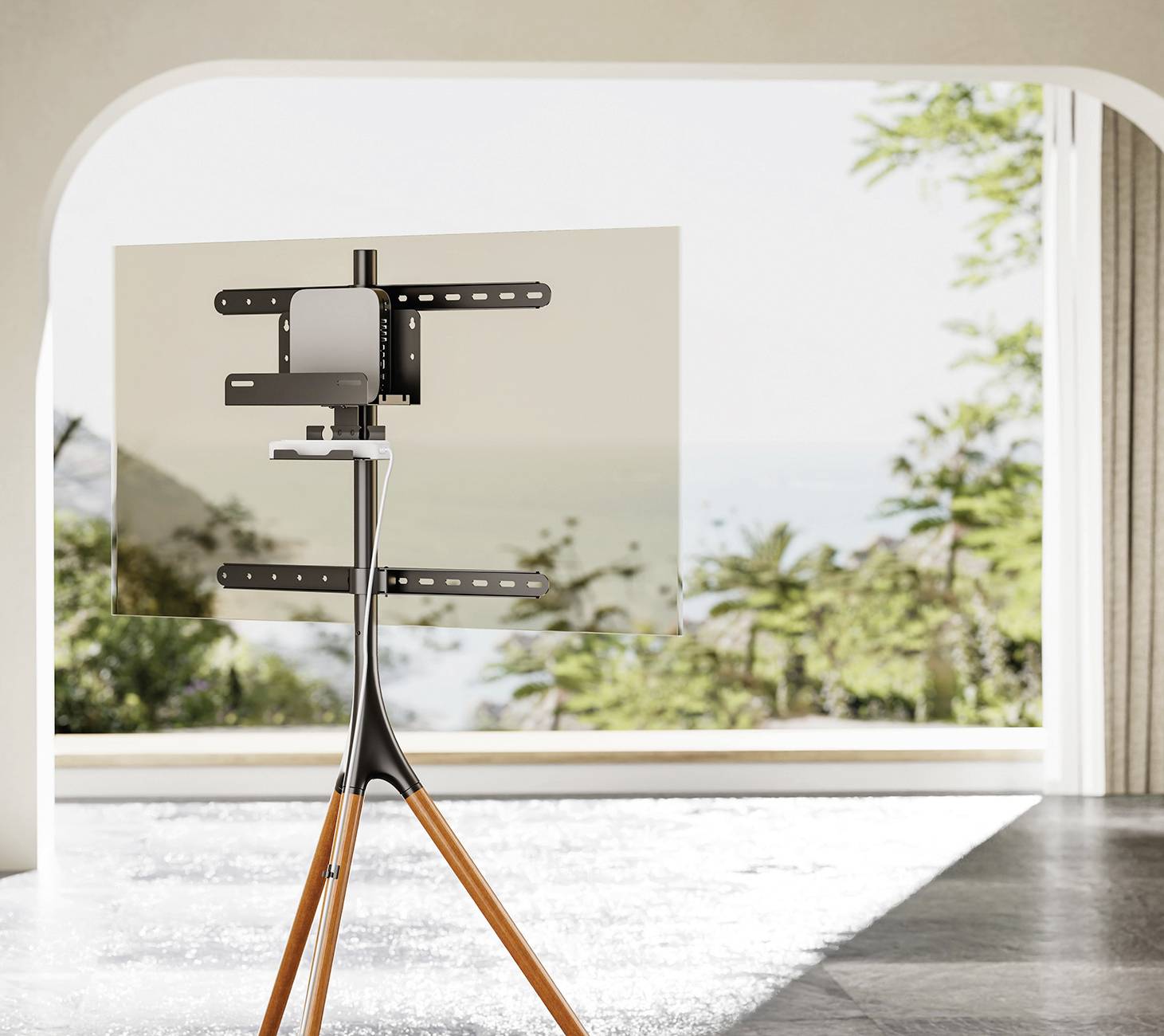 Moderní, minimalisticky navržený stojan na televizi s umístěným TV přístrojem v světlém prostoru s výhledem na slunnou krajinu.