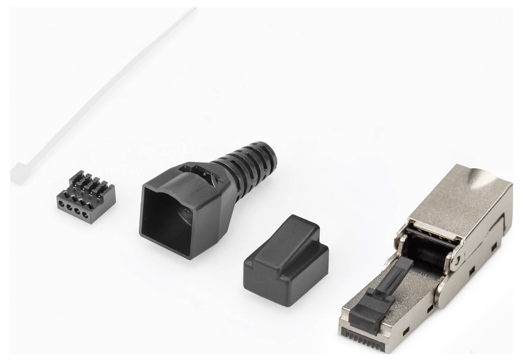 Rozebíratelná RJ45 zástrčka v jednotlivých součástech: stíněný modul, kabelová průchodka, krytka a kontaktní blok vlevo.