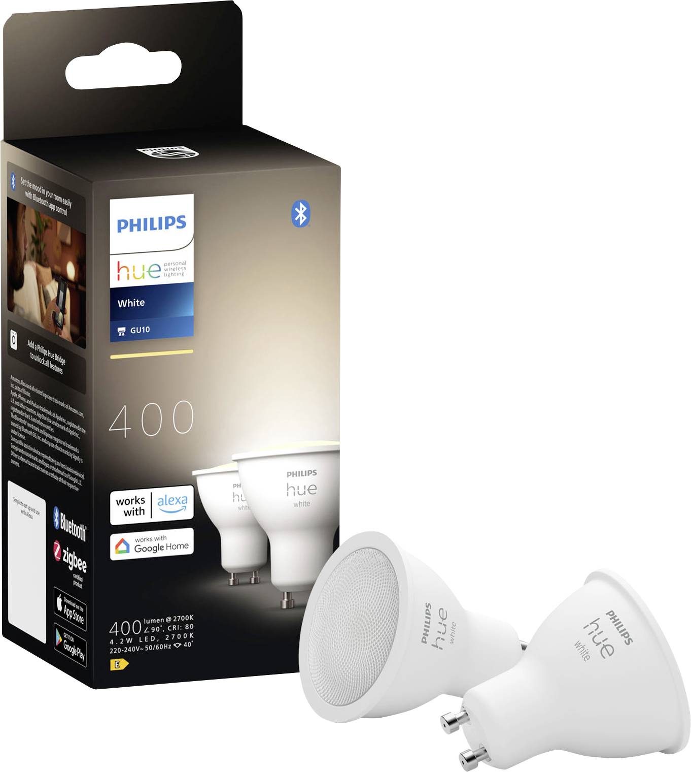 Dvě LED žárovky Philips Hue GU10 vedle jejich obalu. Krabice ukazuje kompatibilitu s Alexou, Google Home a Bluetooth.