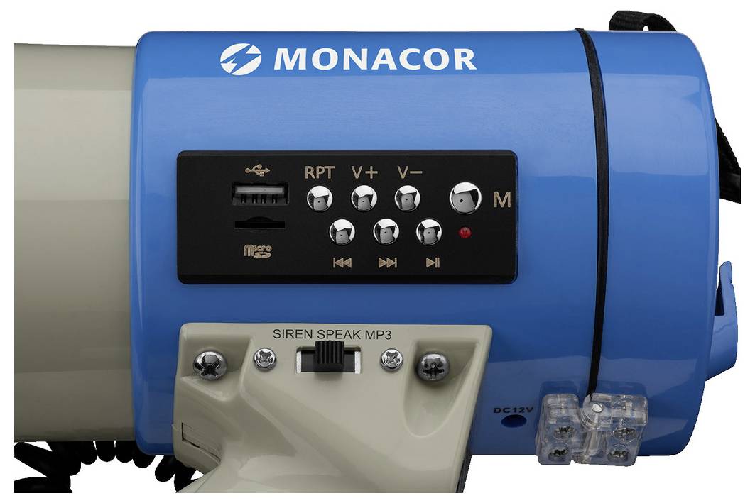 Modrý megafon s šedou rukojetí, černobílými tlačítky a USB portem na přední straně. Nápis: MONACOR.