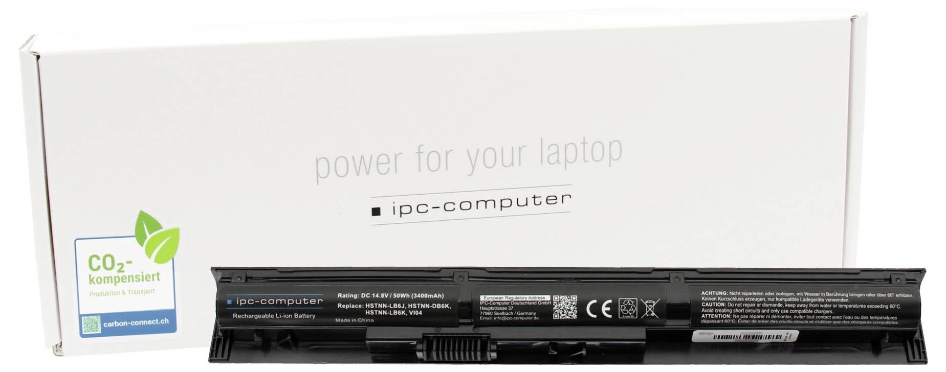 Notebook baterie s obalem. Na obalu je napsáno 'napájení pro váš notebook' a 'ipc-computer'. Je viditelné logo kompenzace CO2.