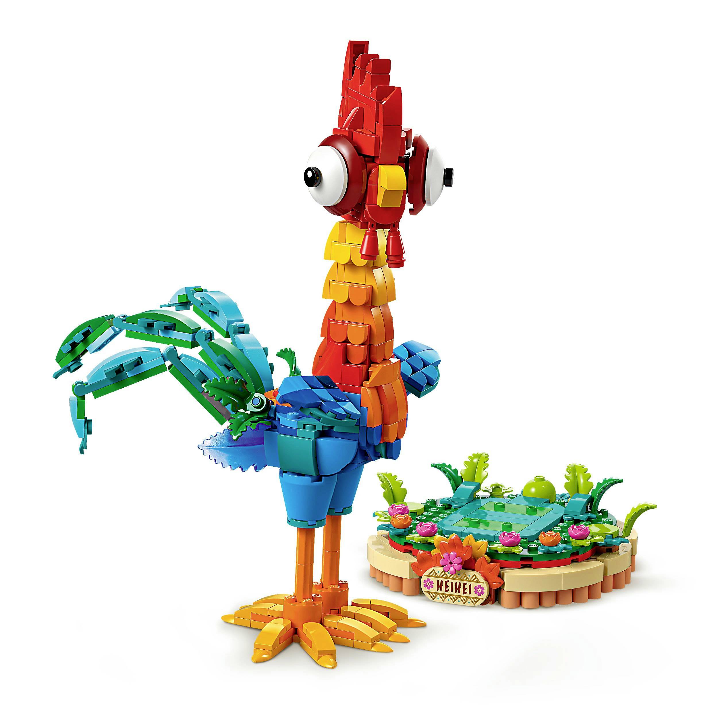 Barevná sada LEGO zobrazuje fantazijního pestrobarevného ptáka s velkýma očima a barevnými péry na malé zelené základně.