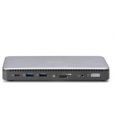 Stříbrný, pravoúhlý dockovací adaptér s několika porty včetně USB, čtečky karet a zvukových konektorů na přední straně.