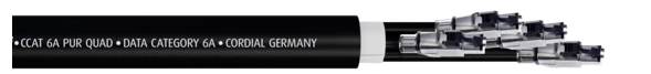 Úryvek zobrazuje černý datový kabel s označením 'CAT 6A PUR QUAD - DATA CATEGORY 6A - OOGIAL GERMANY'.