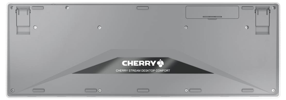 Zadní strana šedé klávesnice s nápisem 'CHERRY STREAM DESKTOP COMFORT' uprostřed.