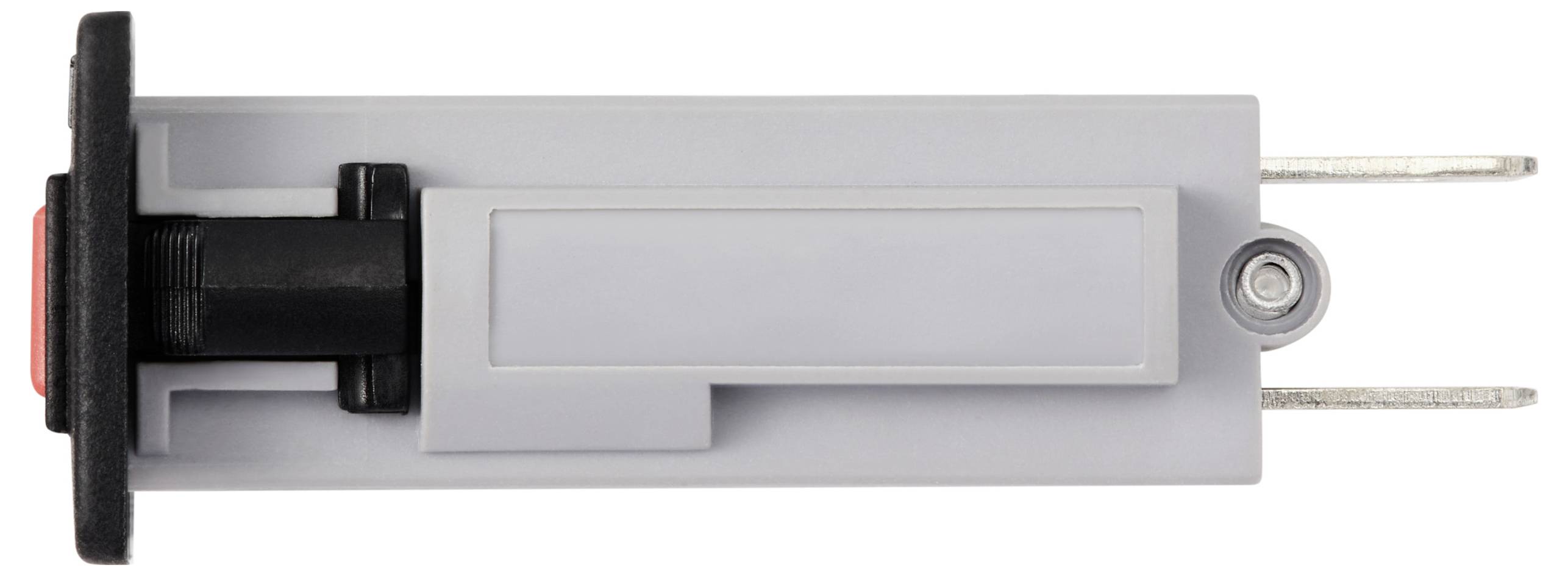 Šedý plastový spínač s černým přepínačem a červeným tlačítkem, pravděpodobně určený pro ovládání nebo propojení elektrických zařízení.