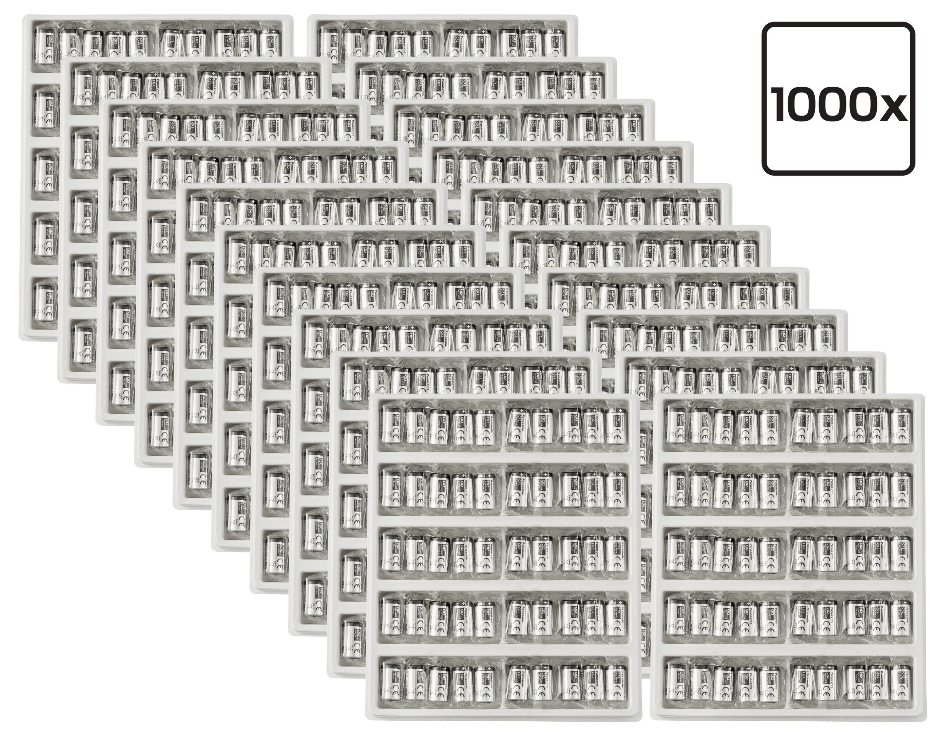 Naskládané tácky malých kapslí se štítkem hlášícím "1000x" s uvedením množství jednoho tisíce.