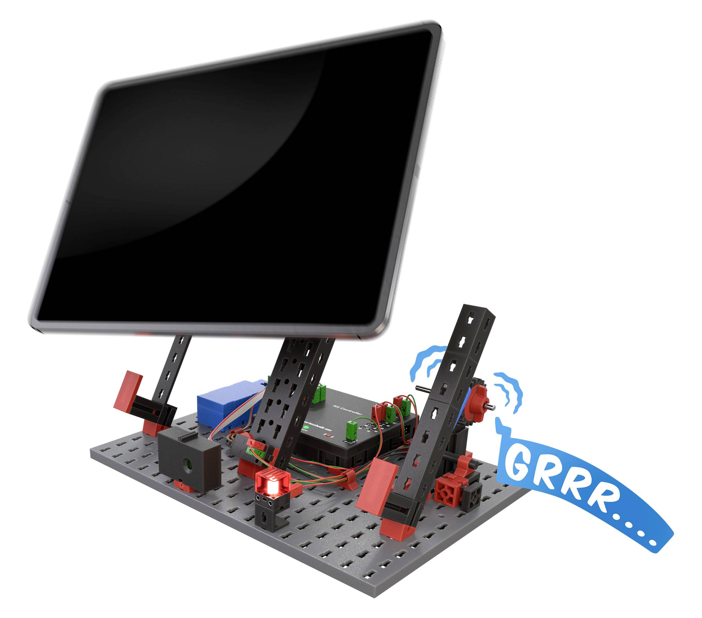 Elektronické zařízení v držáku s kabely a červenými světly na kovovém podstavci, vedle toho řečový bublina v komiksovém stylu s nápisem 'GRRR'.