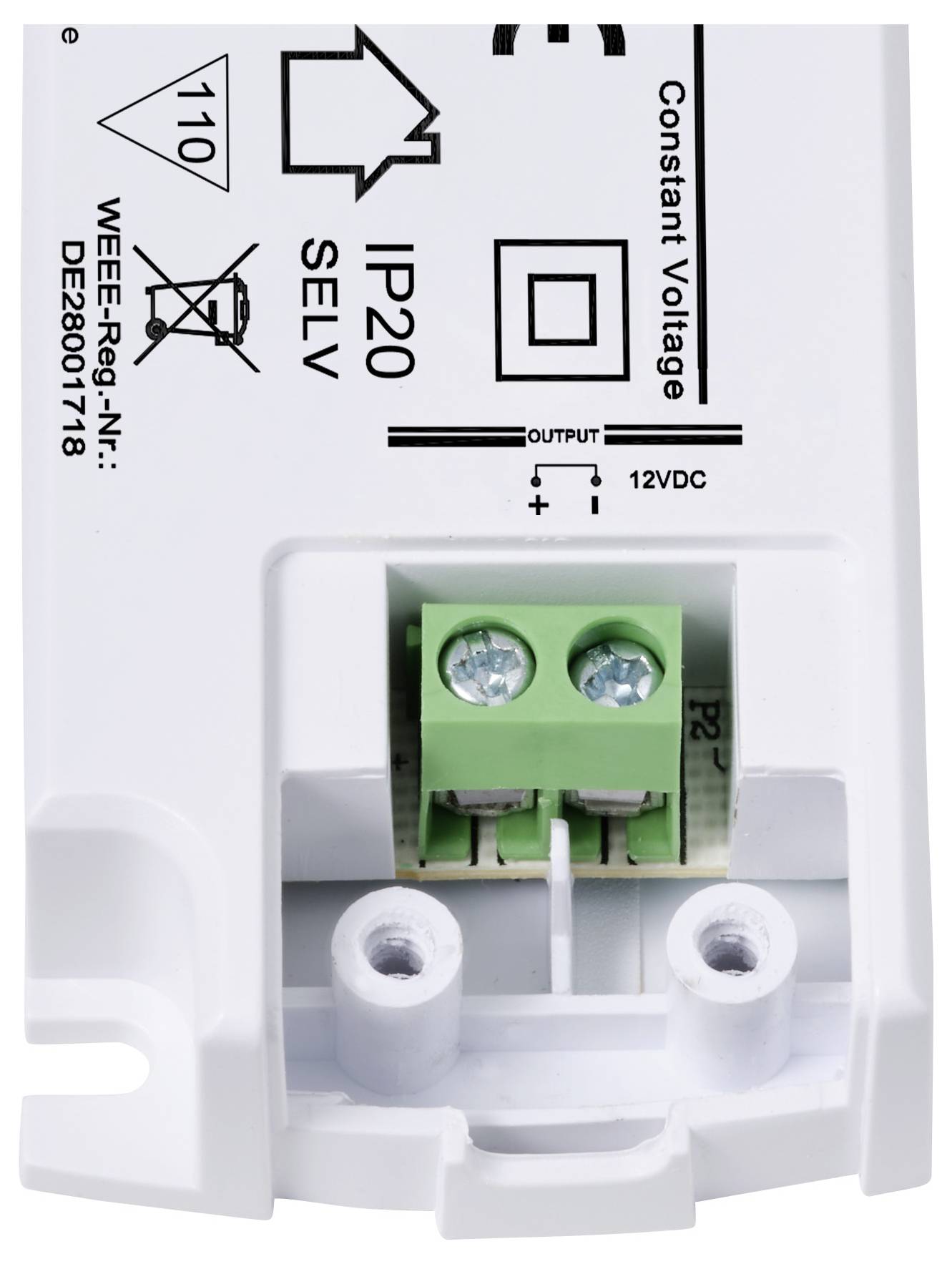 Bílé elektrické zařízení s nápisem 'IP20 SELV Constant Voltage' a zeleným připojovacím blokem se šroubovými svorkami.
