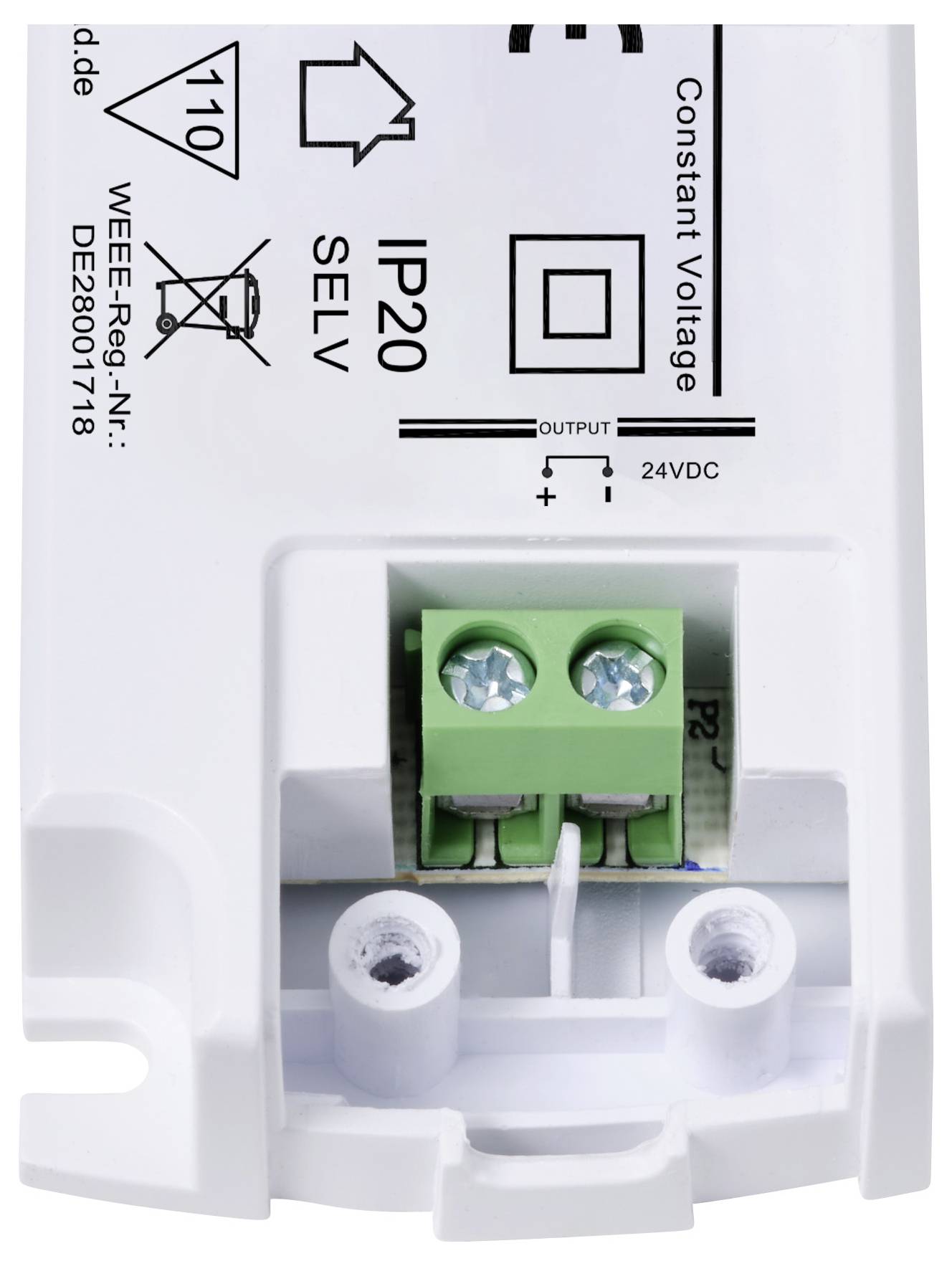 Bílé elektrické zařízení se zeleným připojovacím blokem, označené jako 'Konstantní napětí', 'IP20', 'SELV' a '24V DC výstup'.