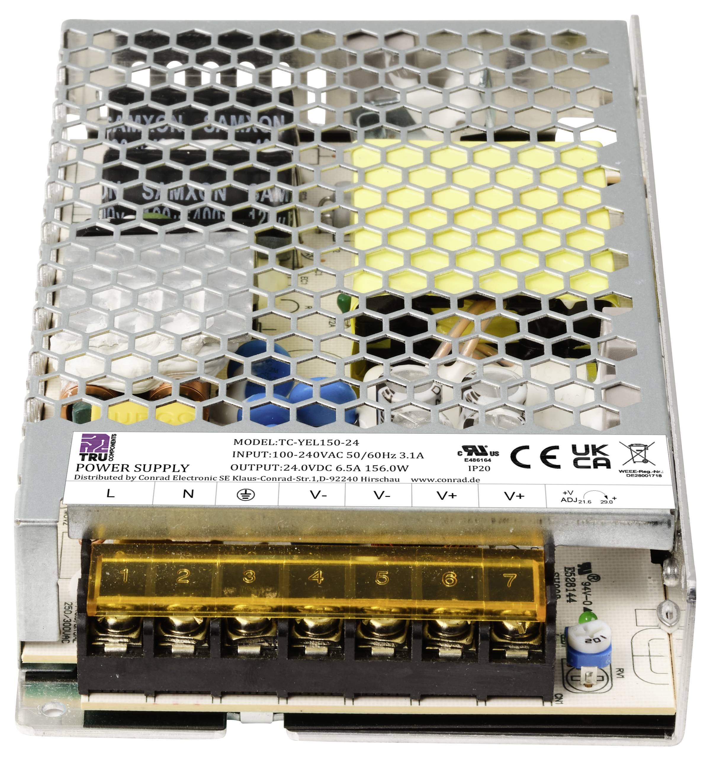 Kovová napájecí jednotka s mřížkovaným povrchem, značeními a přípojkami. Vstup: 100-240V AC, výstup: 24V DC.
