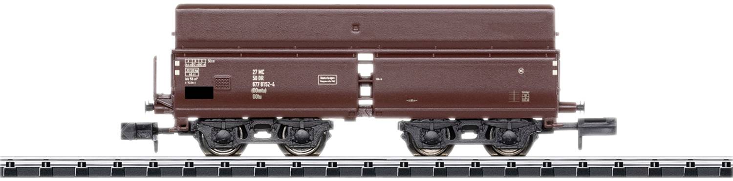 Hnědý modelový nákladní vůz na koleji v měřítku 1:87, boční pohled, s detailním popisem a součástkami.