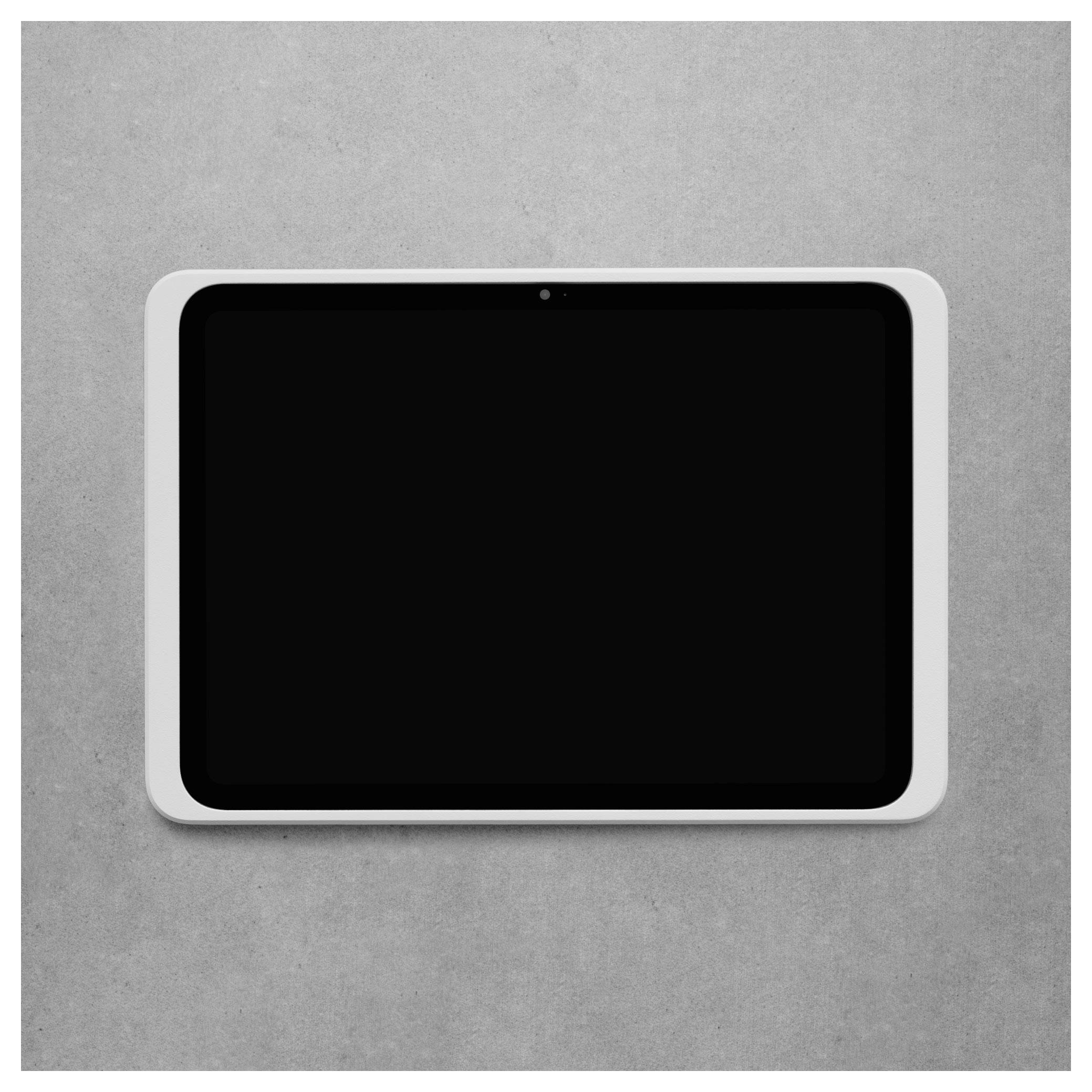 Tablet s černou obrazovkou a bílým rámečkem na šedém povrchu.