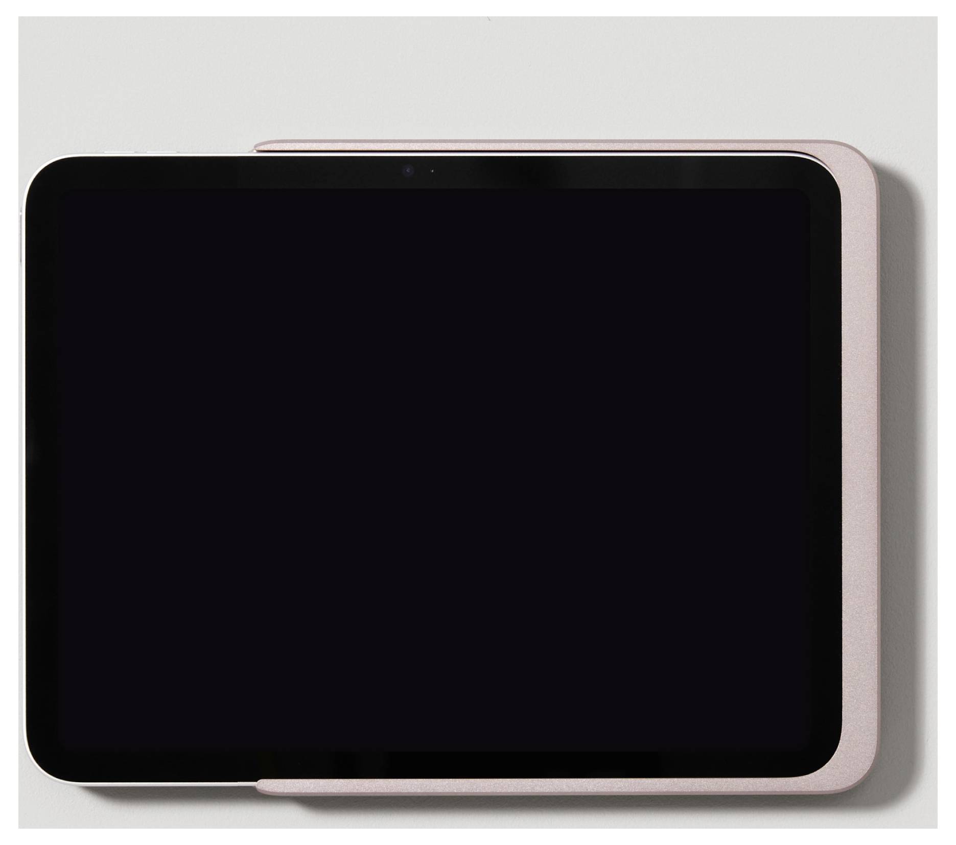 Tablet s růžovým ochranným pouzdrem, pohled shora.