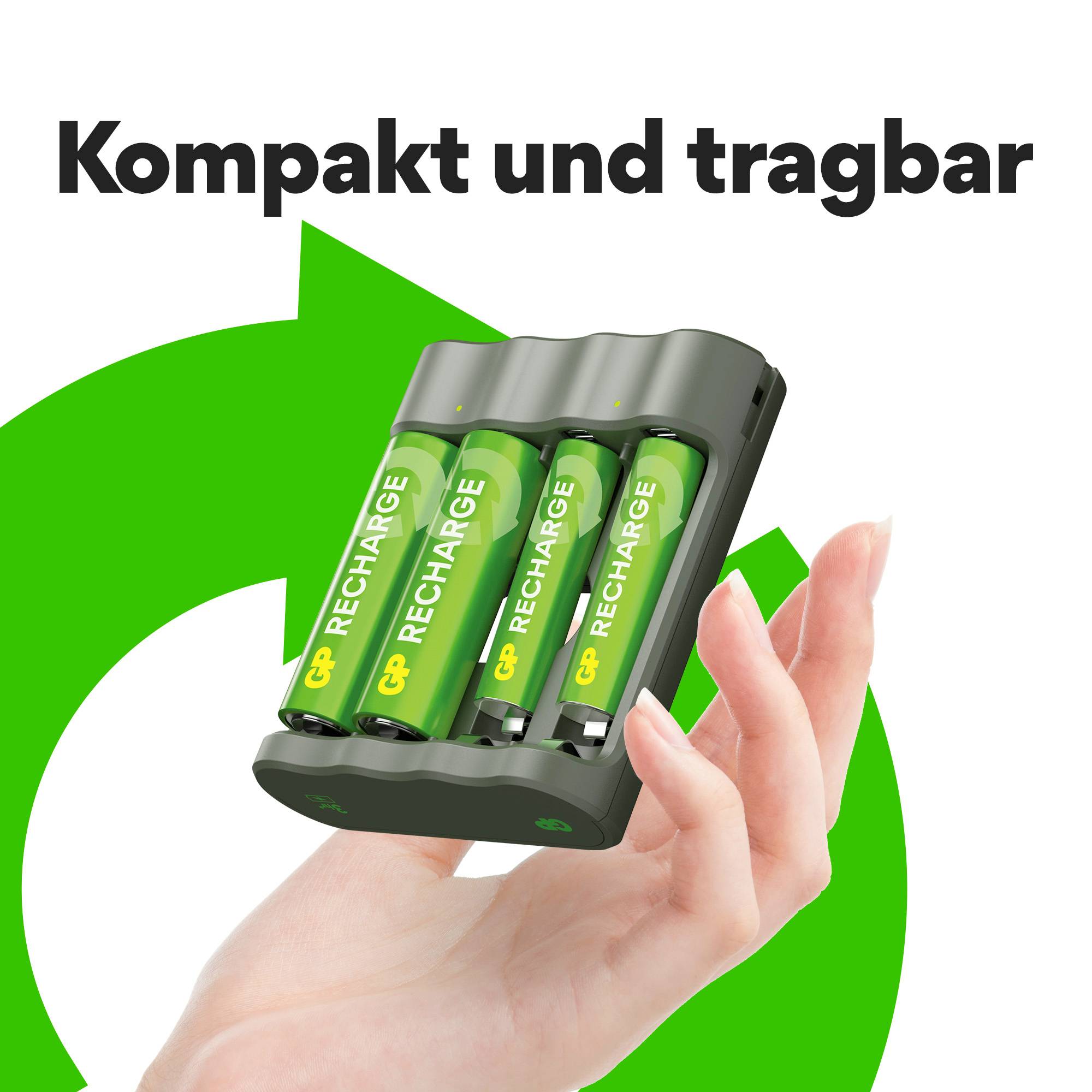 Ruka drží nabíječku s zelenými bateriemi AA, nahoře text "Kompaktní a přenosné", obklopený zeleným kruhovým symbolem.