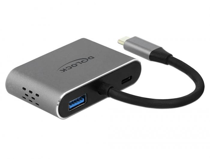 Stříbrný USB-C hub s jedním USB-A, jedním HDMI a jedním USB-C portem. Vyvinut pro připojení zařízení.