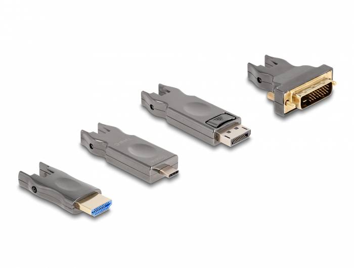 Čtyři adaptéry pro různé videoporty: HDMI, Mini DisplayPort, DisplayPort a DVI. Leží vedle sebe.